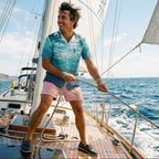 Man on a sailboat enjoying a sunny day at sea