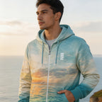 Man wearing a hoodie with a scenic design by the ocean